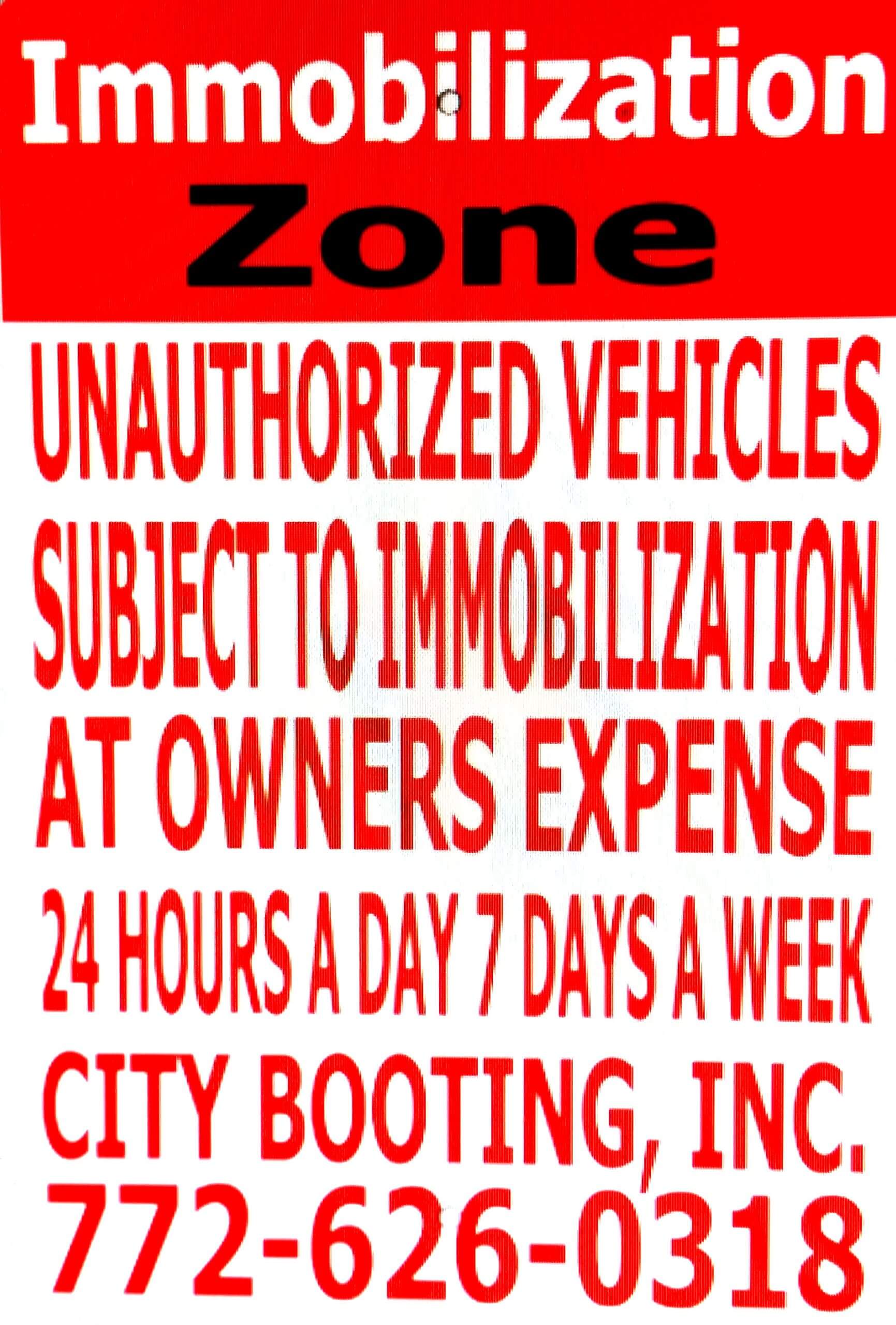 StreetSign-scaled (1) A poster of immobilization zone with red background
